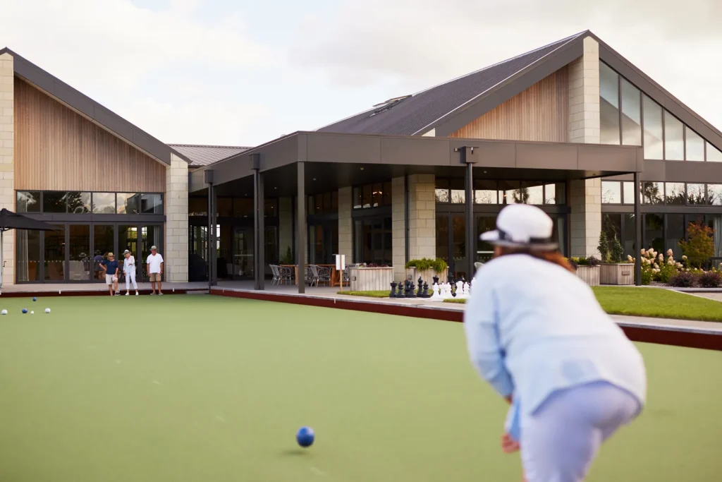 Residents playing outdoor bowls outside the Clubhouse at Tamahere Country Club