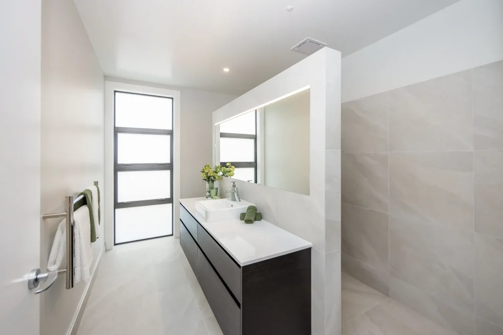 Tiled modern bathroom at retirement villa in Tamahere Country Club