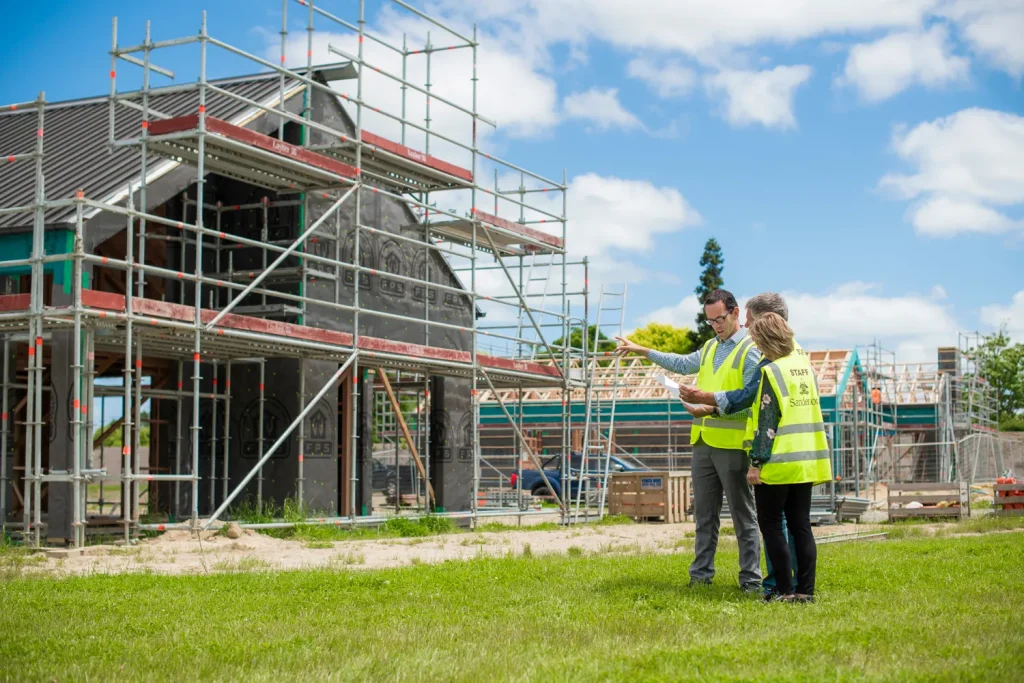 Residents on site inspecting building construction of their new villa at Tamahere Country Club