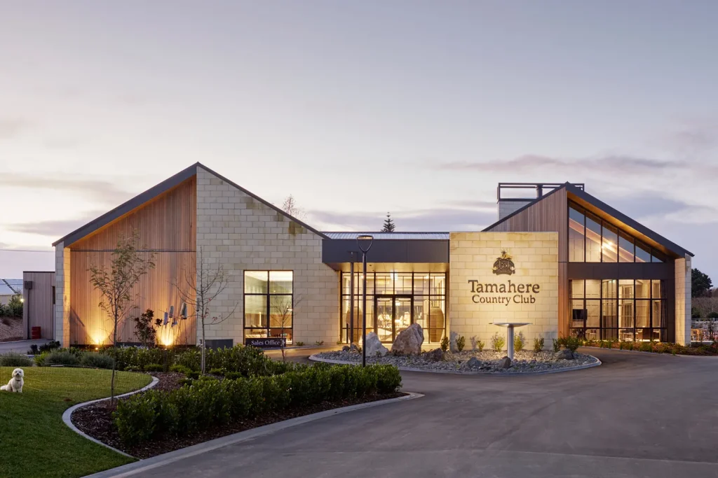 Tamahere Country Club Clubhouse facade at dusk.