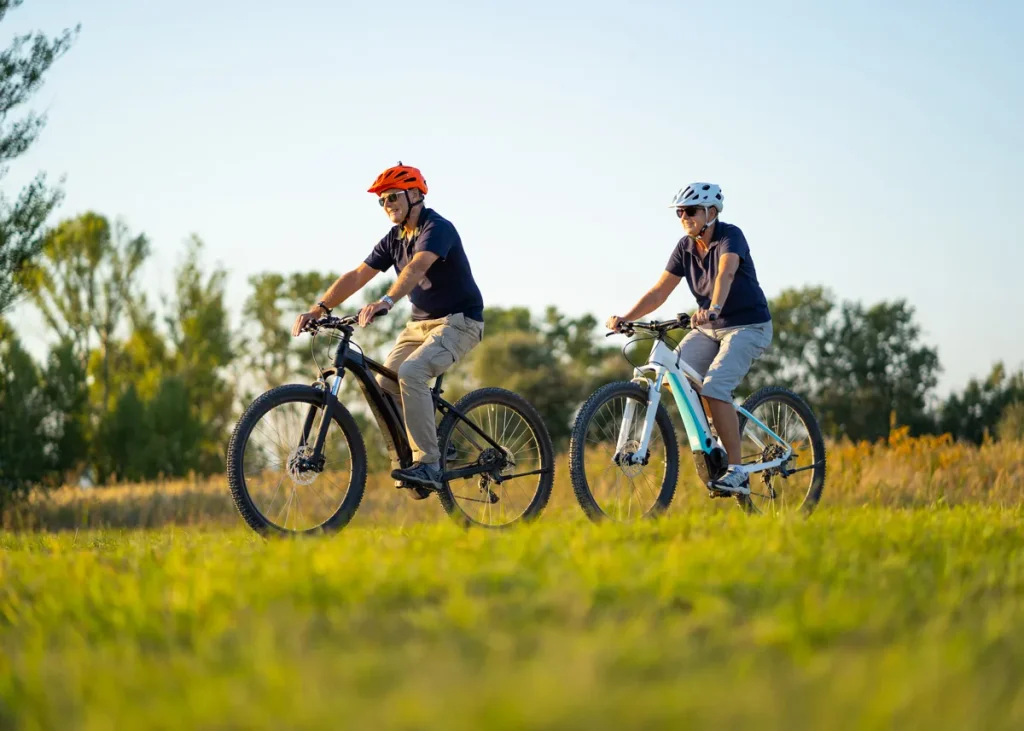 Residents enjoying e-biking on bike trail in the country at Tamahere